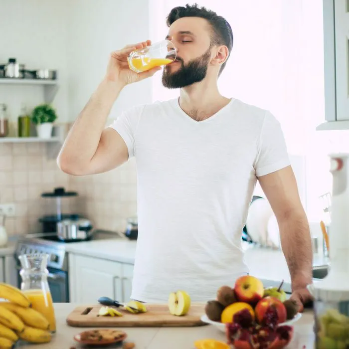 man drinking juice