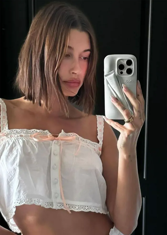 Hailey Bieber showcasing a trendy graduated bob hairstyle.