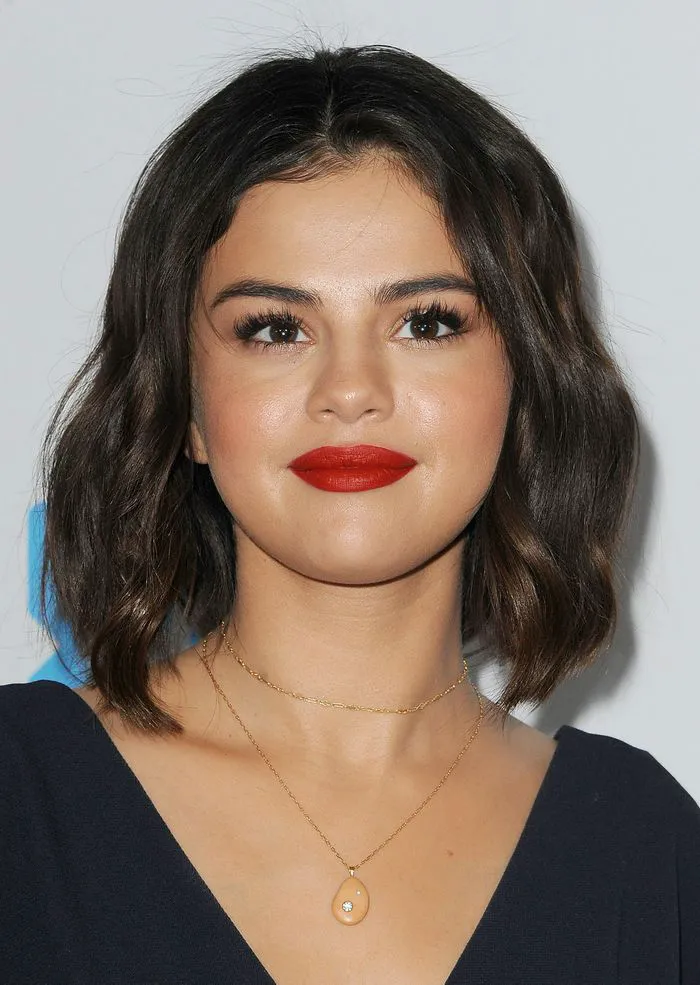 Selena Gomez sporting a chic graduated bob haircut.