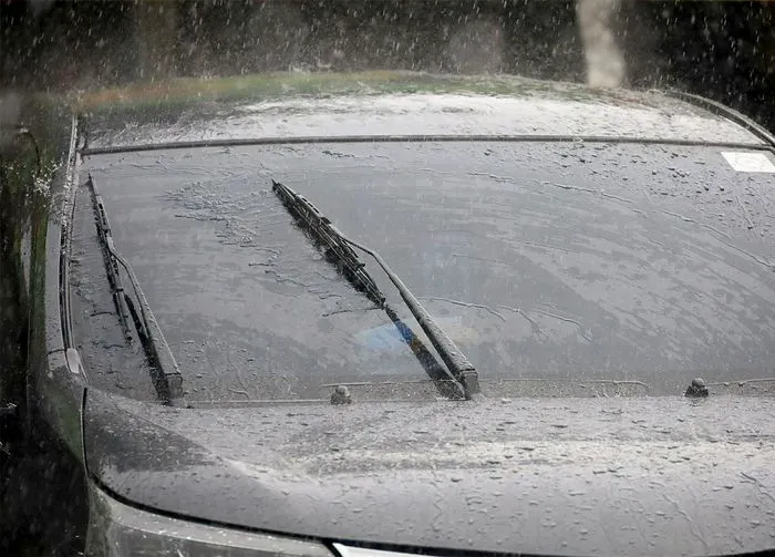 windshield wipers on a car in rain