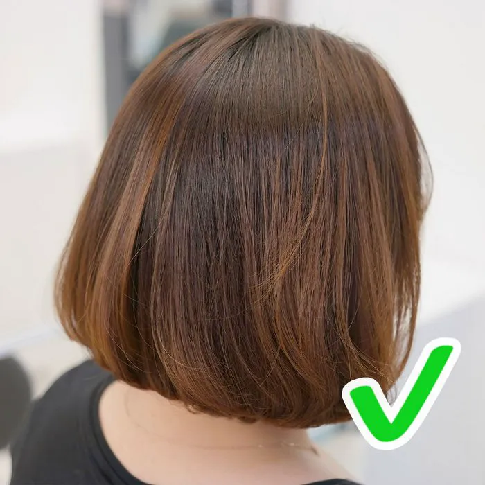 Brown hair short bob haircut with a green checkmark