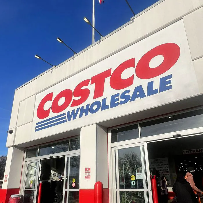 Bright and inviting Costco storefront under sunlight.