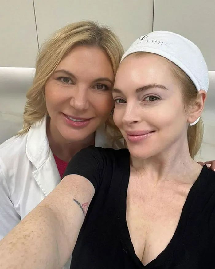 Lindsay Lohan poses with Dr. Radmila Lukian at an event.