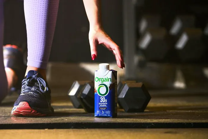 Organic protein powder in a sleek container.