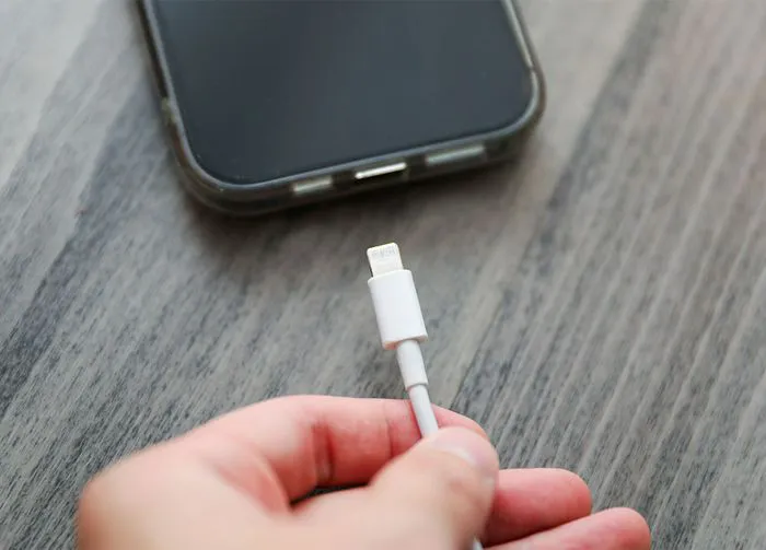 plugging-in-iphone