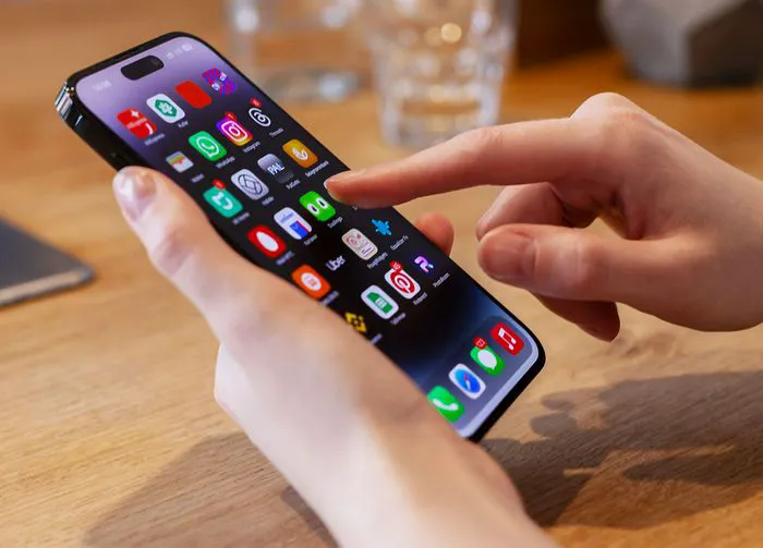 person-using-iphone-apps
