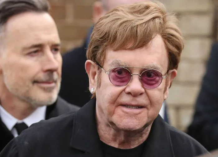 "Elton John departing from the Derek Draper funeral"
