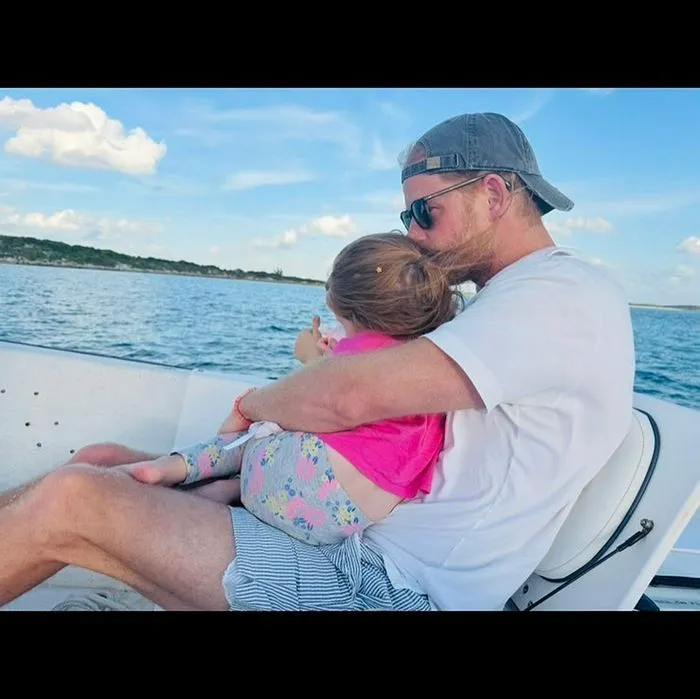 Prince Harry and Princess Lilibet on a boat