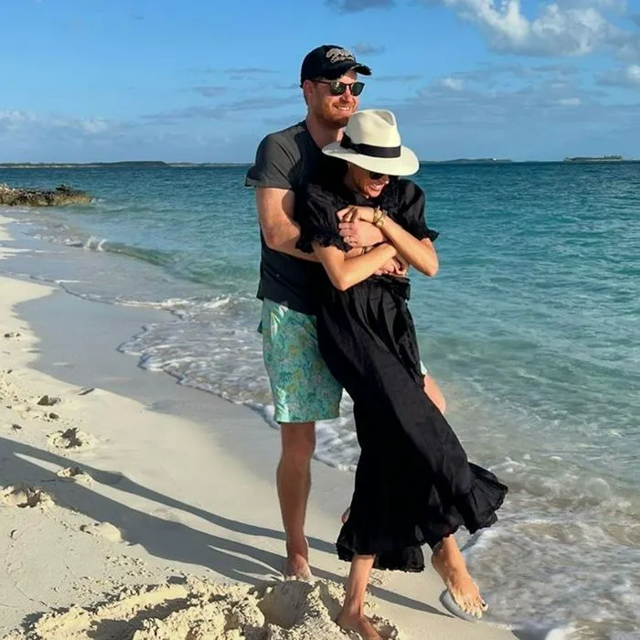 Prince Harry hugs Meghan Markle on the beach
