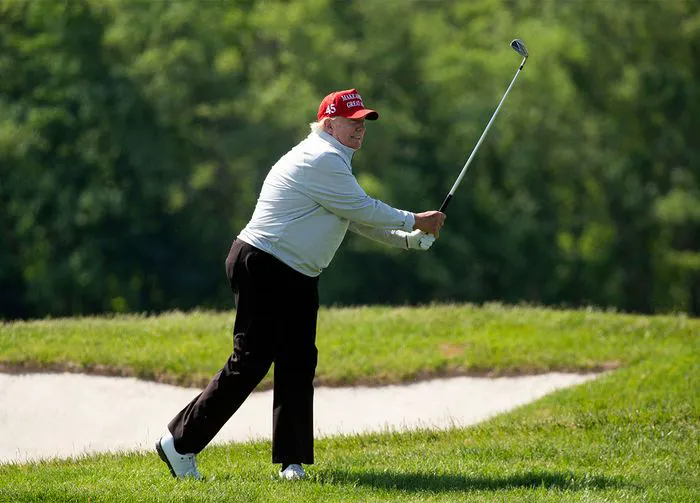 Donald Trump playing golf 2023