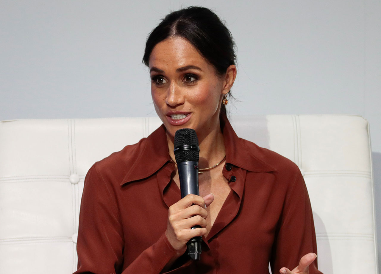 Meghan Markle holding microphone