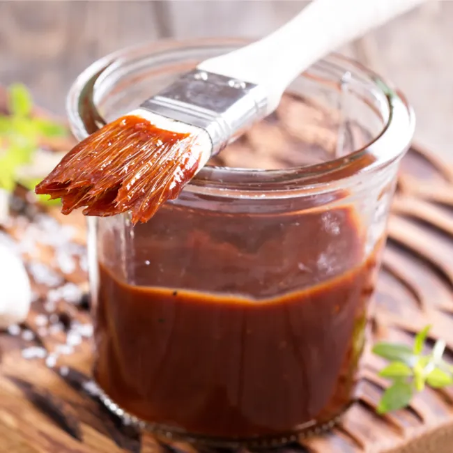 BBQ sauce jar with a rustic design.