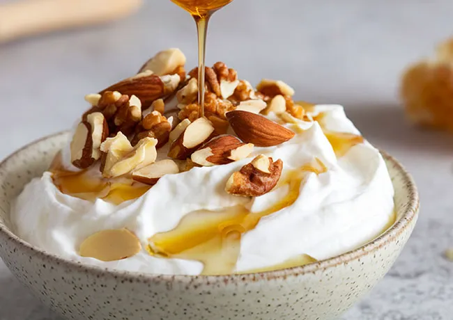 bowl of Greek yogurt with honey