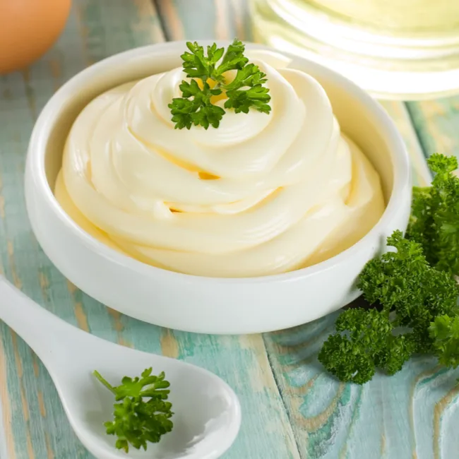 Bowl of creamy mayonnaise for culinary use.