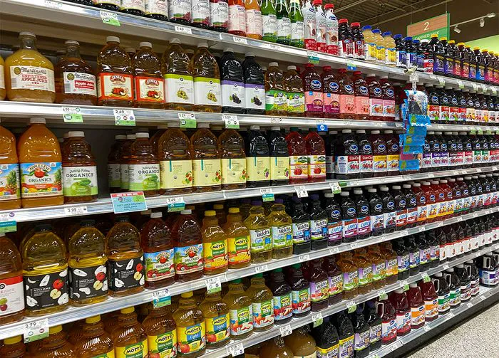 rows of fruit juice in store