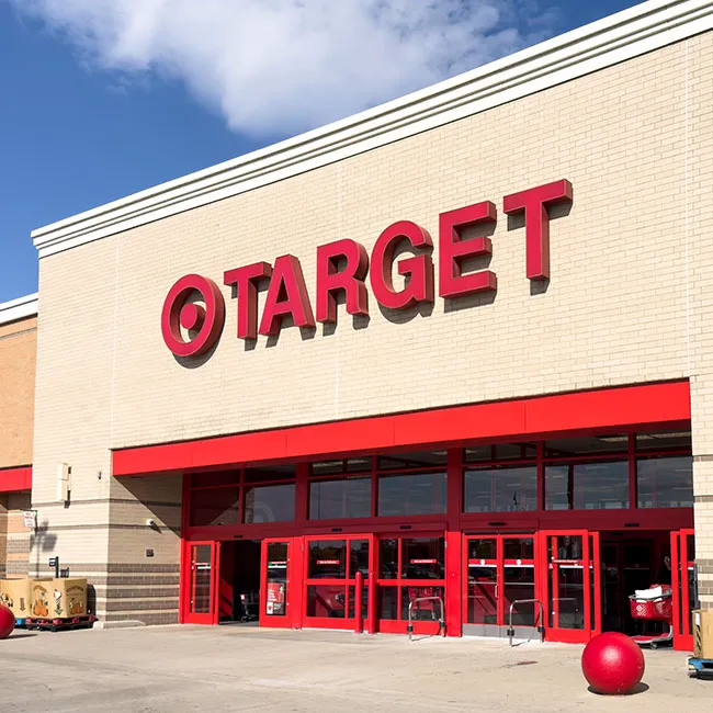 Target storefront against a clear blue sky.