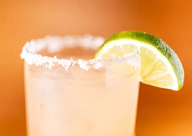 Refreshing margarita cocktail with a salted rim