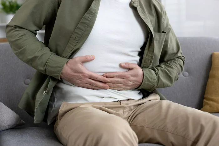 "Woman experiencing chest pain"