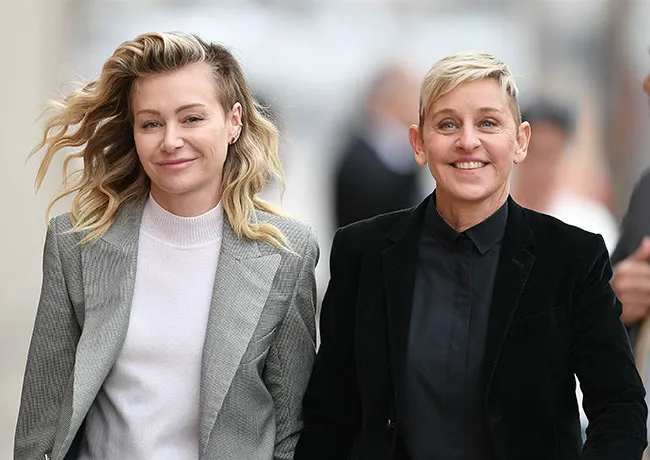 Ellen DeGeneres and Portia de Rossi smiling together.