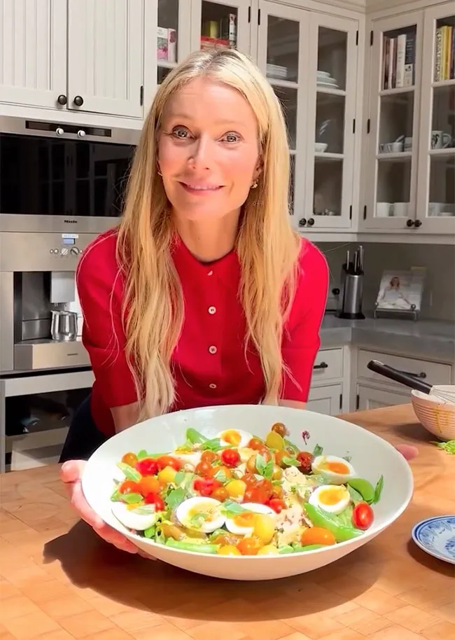 Gwyneth Paltrow making salad with her hair down