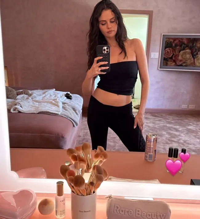 Selena Gomez poses in a tube top mirror selfie.