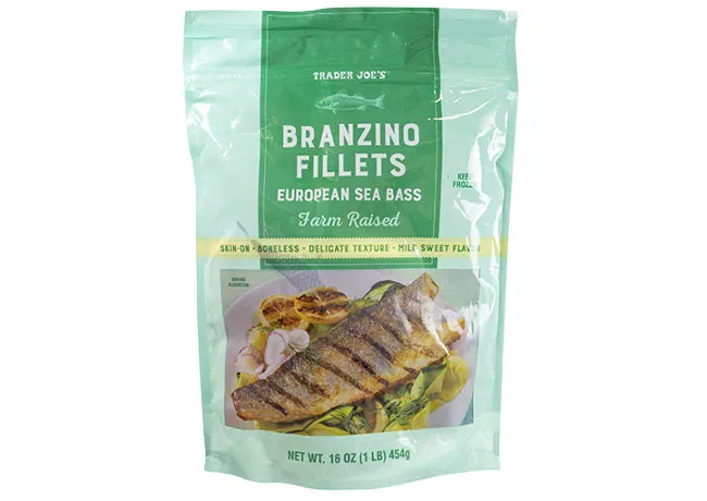 Trader Joe's branzino fillets on a wooden cutting board.