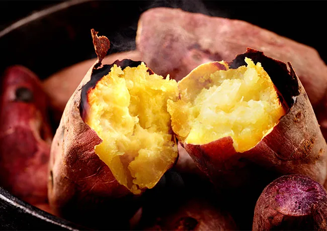 Delicious roasted sweet potato garnished with herbs and spices.