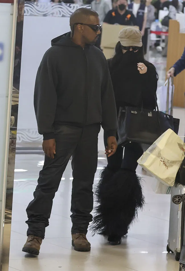 "Kanye West arriving in Seoul with wife Bianca Censori"