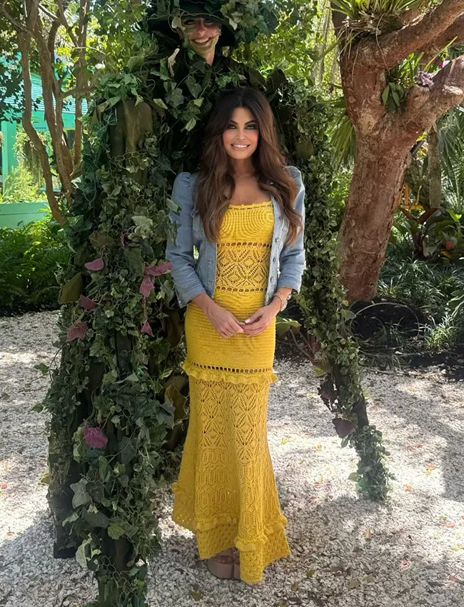 Kimberly Guilfoyle in a vibrant yellow crochet dress.