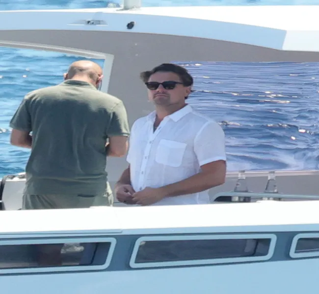 "Leonardo DiCaprio relaxing on a yacht during his vacation"