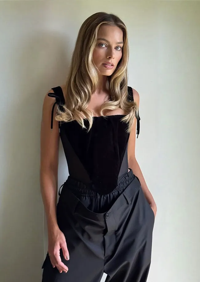 Margot Robbie baggy pants tiny corset