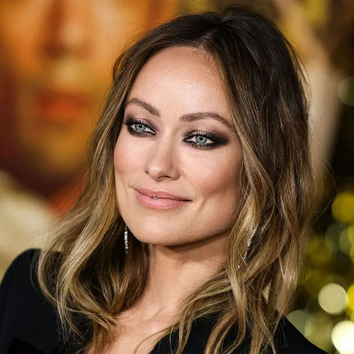 Olivia Wilde posing elegantly at a Hollywood event.