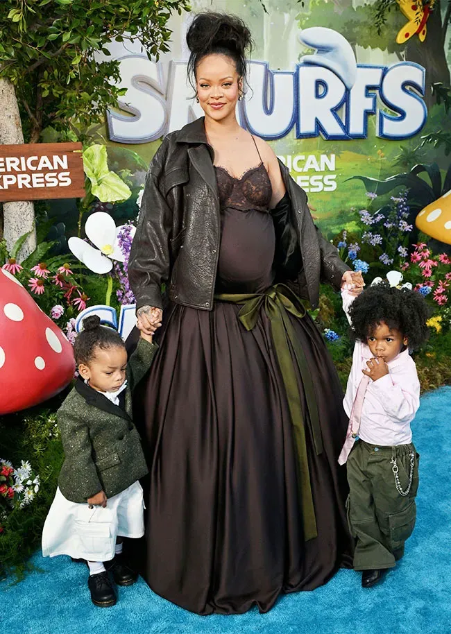 Rihanna at Smurfs premiere with children Riot Rose and RZA.