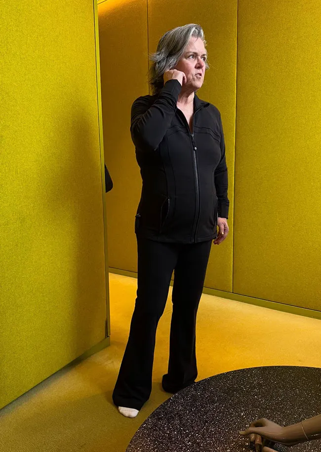"Rosie O'Donnell in a dressing room showcasing her weight loss"