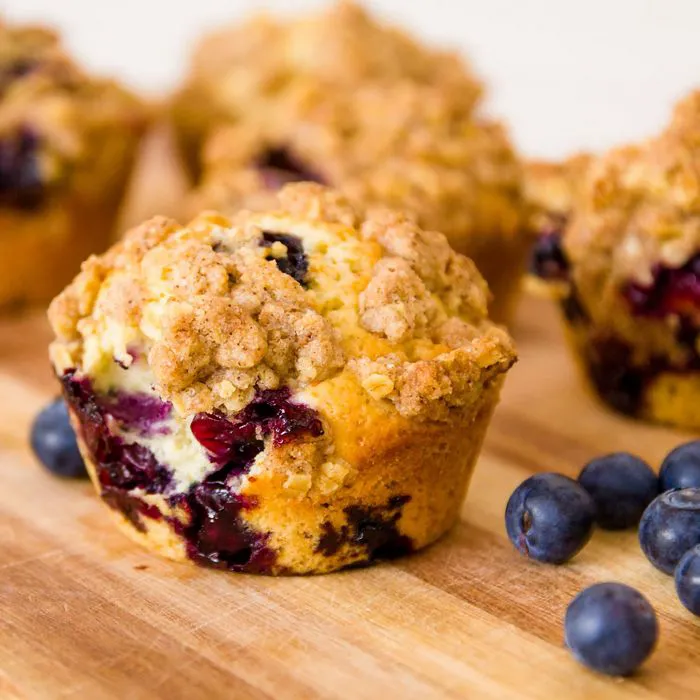 Freshly baked blueberry muffins on a rustic table