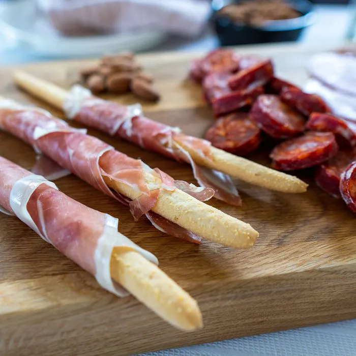 processed meats on charcuterie board