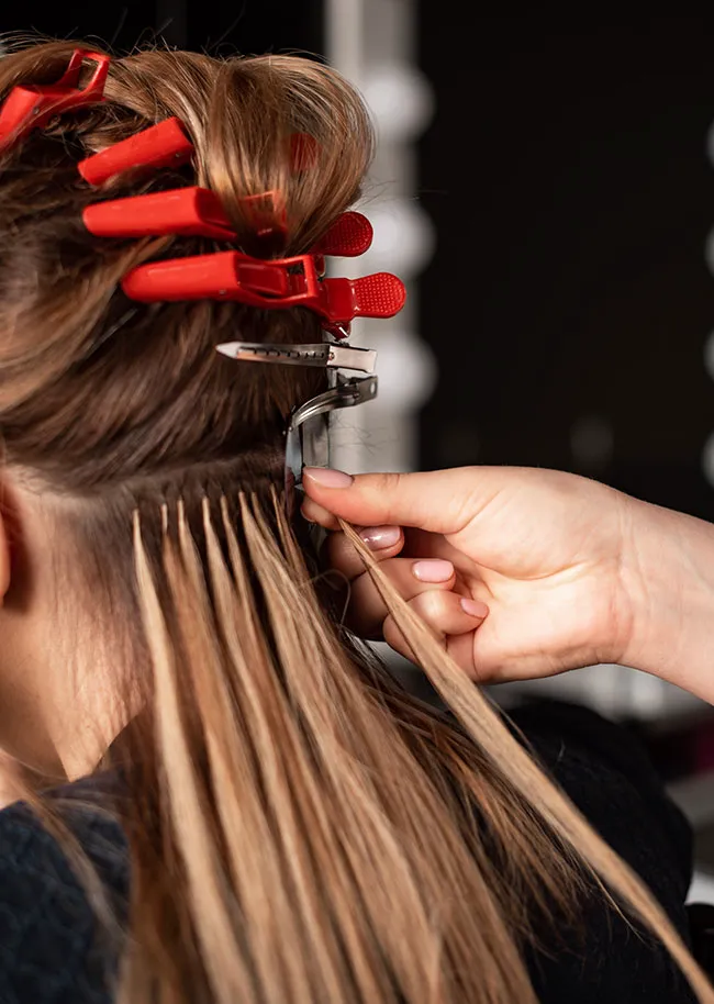 woman-getting-hair-extensions