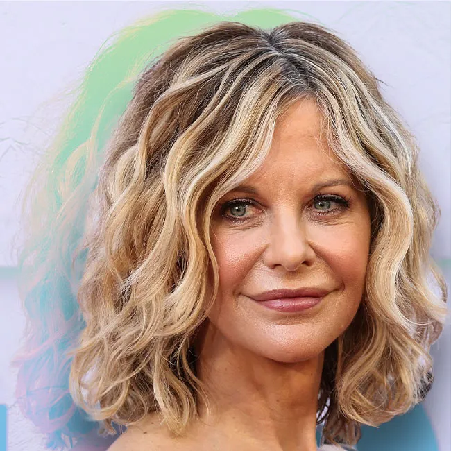 Meg Ryan with curly hair in a casual setting.