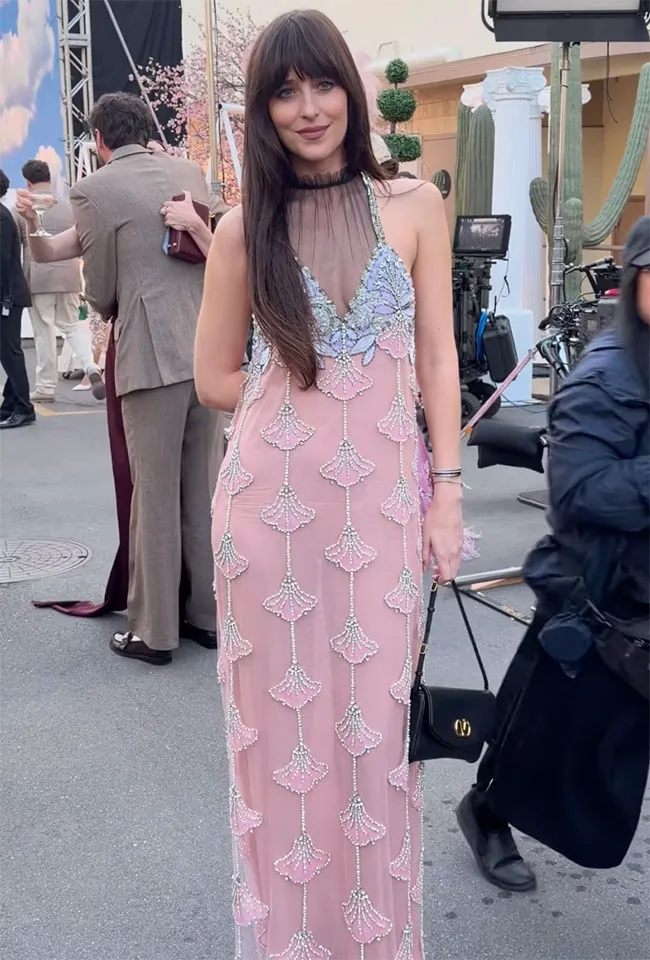 Dakota Johnson at Vogue World event, showcasing glamorous fashion.