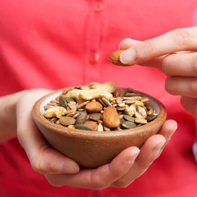 "A colorful bowl of mixed nuts and seeds"