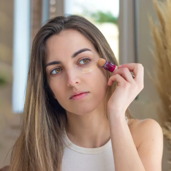 Close-up of bridal makeup featuring natural beauty products.