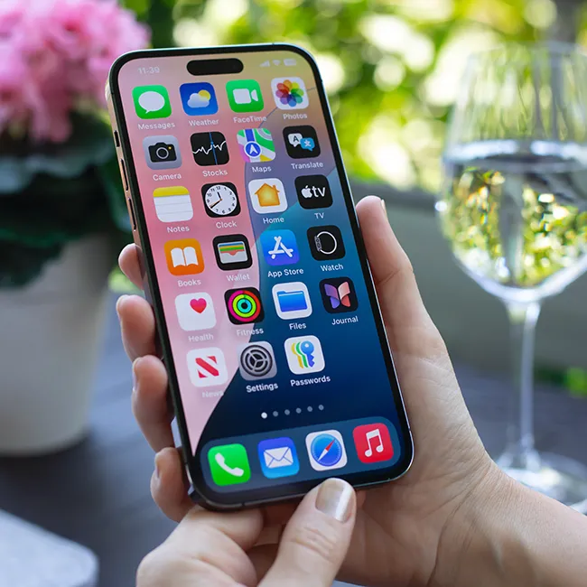 "Woman looking at smartphone apps on her iPhone"