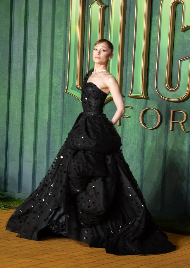 ariana grande wore a 73-year-old dress to the premiere ArianaGrande wore a 73 year old dress on the #WickedForGood red carpet. Designed by the original 'Wizard of Oz' costume designer Gilbert Adrian in 1952, the 32 year old Glinda actress was