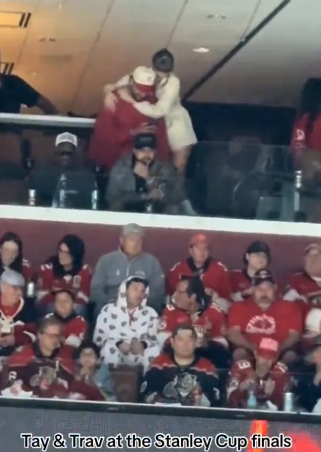 Travis Kelce and Taylor Swift hugging Stanley Cup final