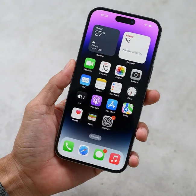 Hand holding iPhone 14 Pro Max showcasing modern technology.