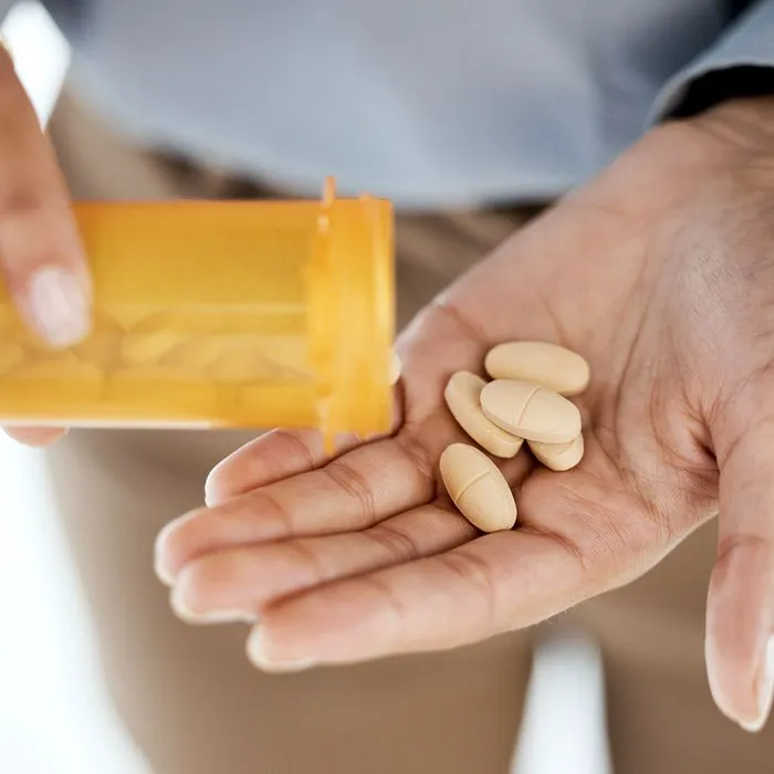 woman taking pills