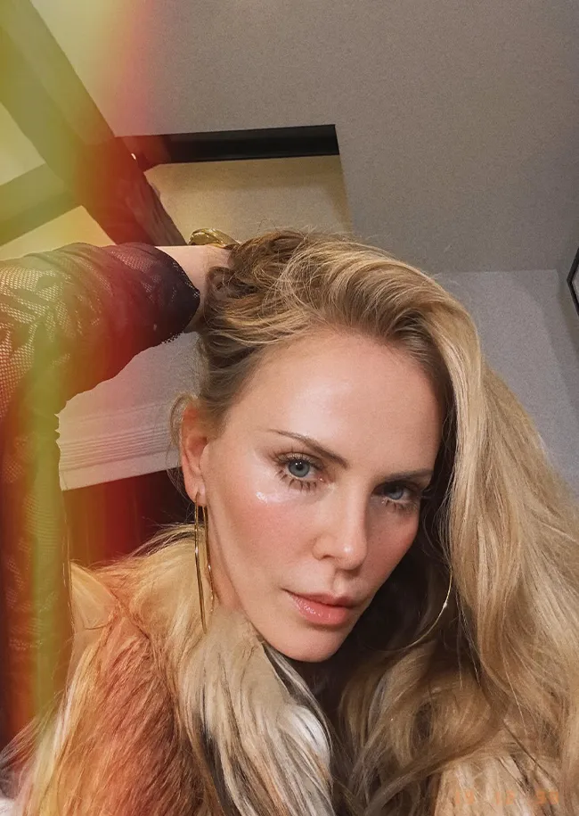 "Charlize Theron Instagram selfie in lace catsuit"