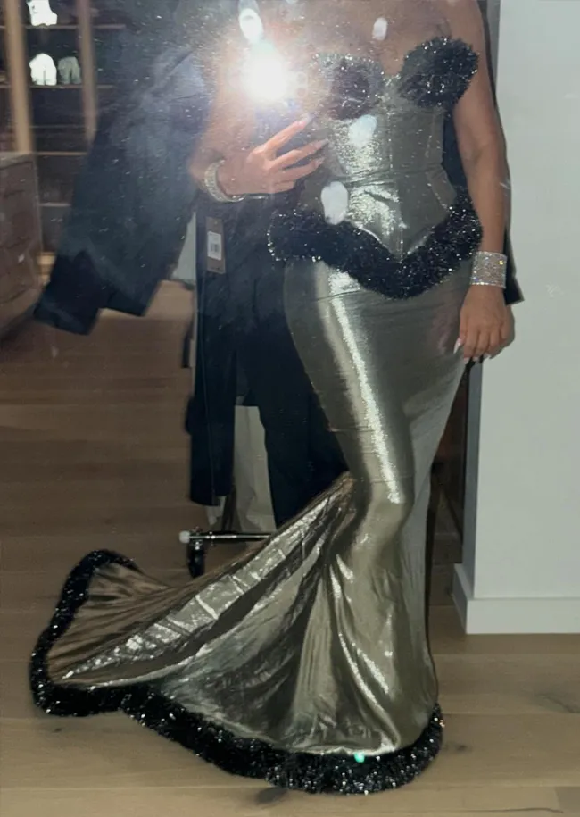 Kim Kardashian in Thierry Mugler dress at Christmas Eve 2025 event.