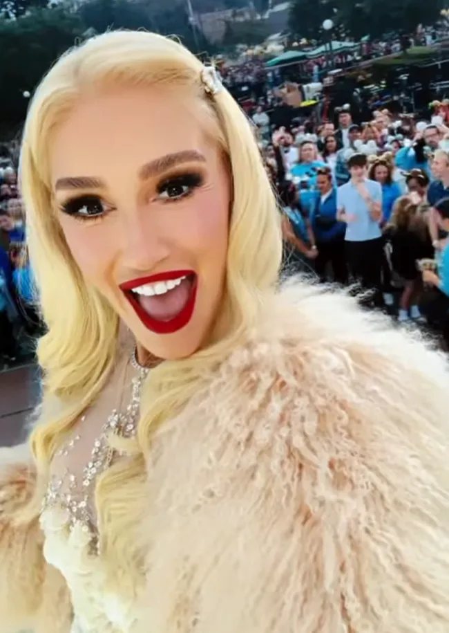 Gwen Stefani at Disney Parks' Christmas Day Parade in Sleeping Beauty's Castle.
