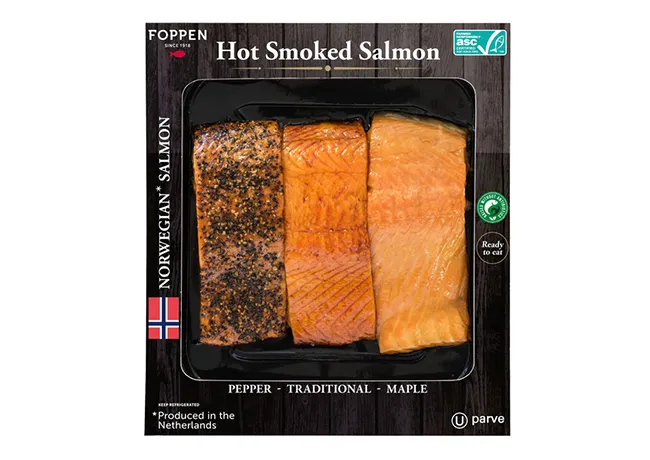 Delicious hot smoked salmon garnished with herbs.